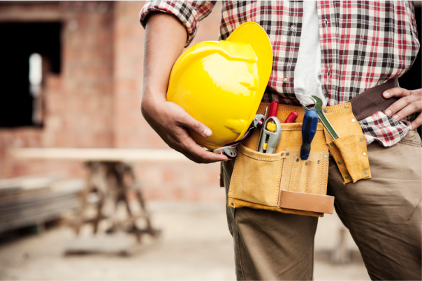 Worker with hard hat and tools belt